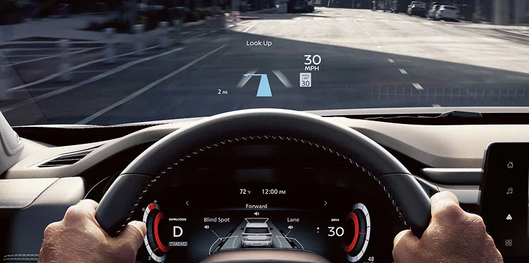2026 Nissan Pathfinder Head-Up Display projecting directions, speed, and music info onto the windshield.